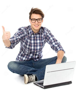 Photo on a white background of a young man sitting cross-legged in front of an open laptop. He is smiling and giving the viewer a thumbs up.